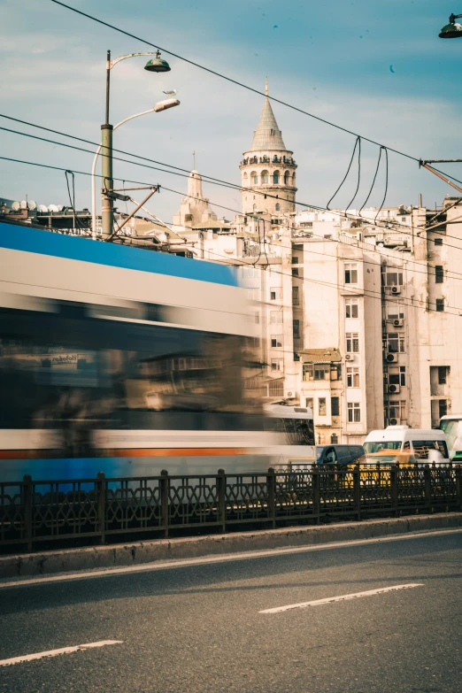 a long train that is going by a city