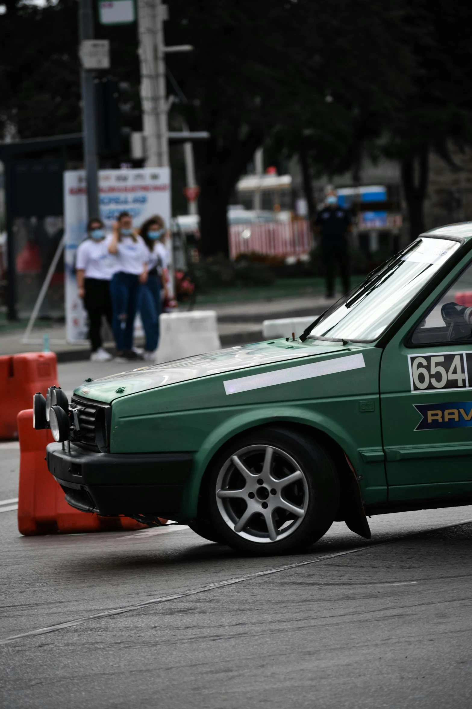 a small car with a number plate in the street