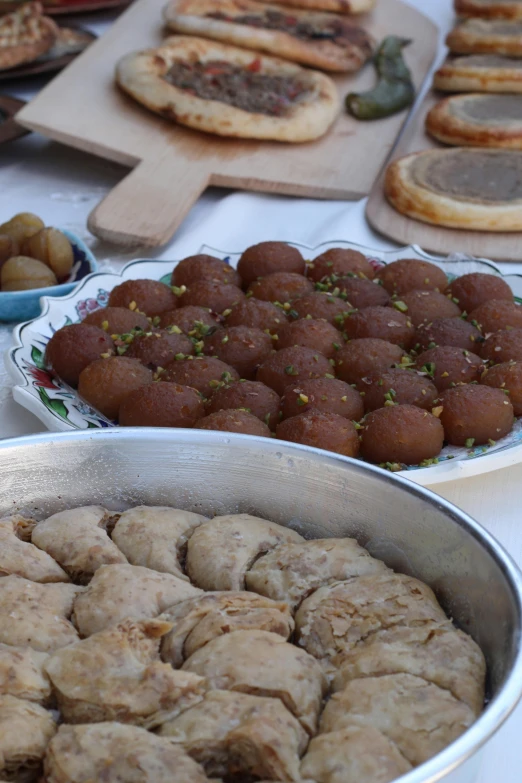 some pastries are in pans on a table