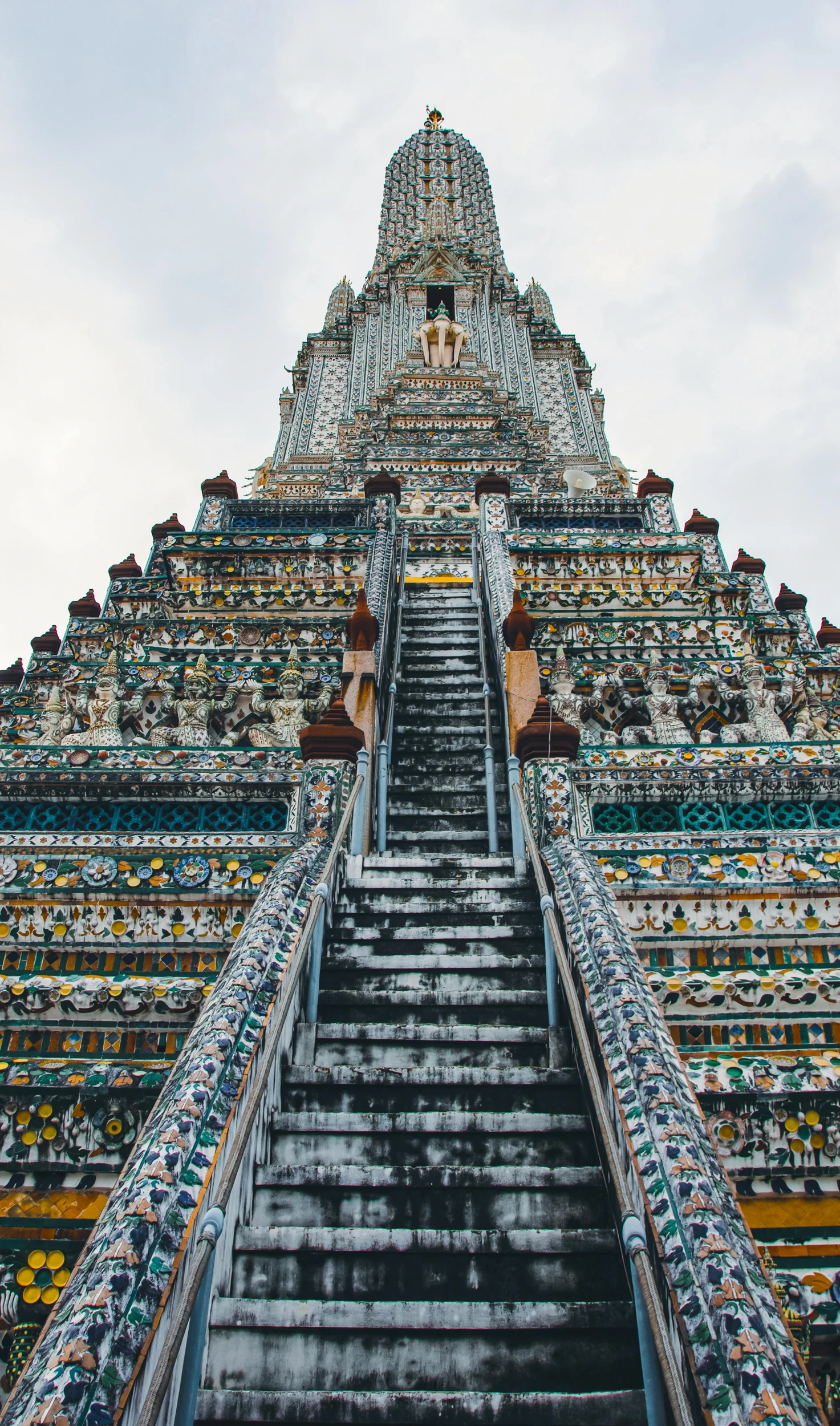 an image of stairs going up to a huge structure