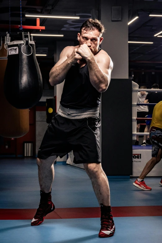 a man on a boxing ring punching a punch