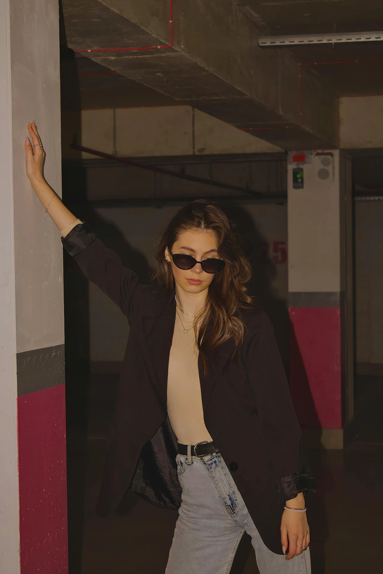 a woman with a white shirt and a pair of sunglasses