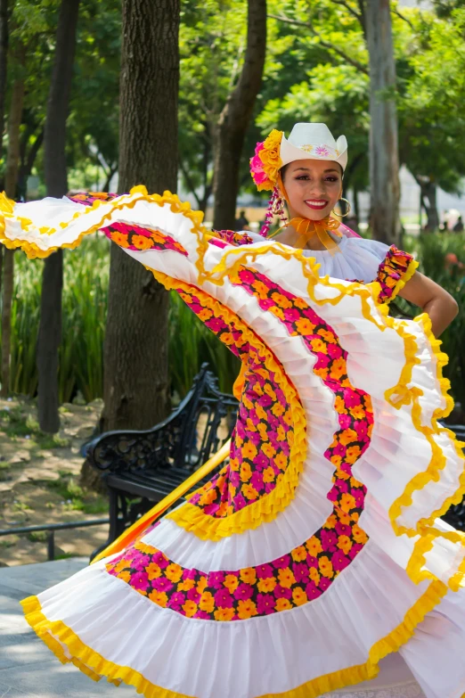 an older woman wearing a colorfully decorated dress