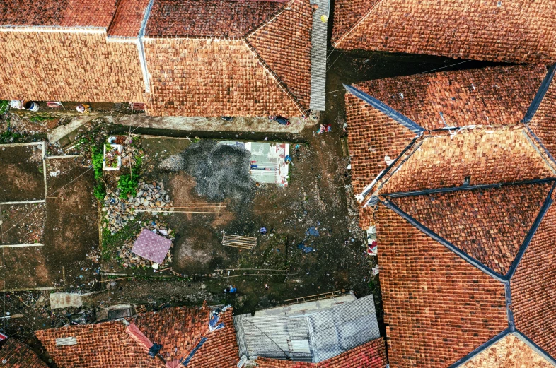 the view from above of a red tiled building