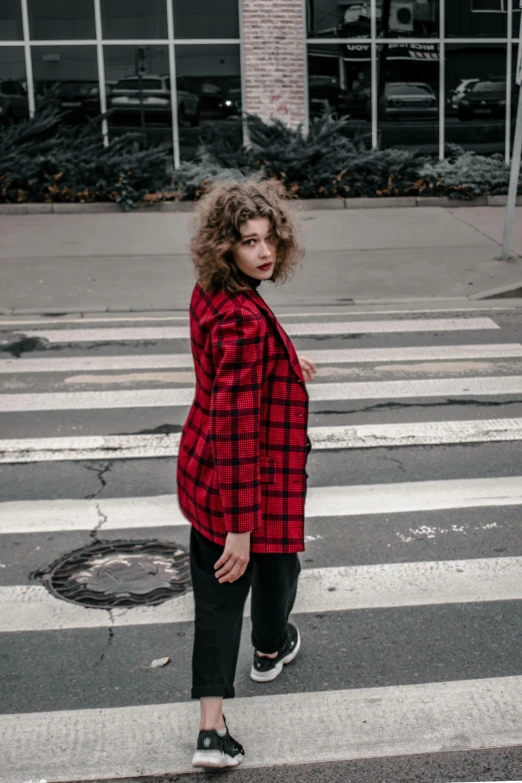 a woman that is standing in the street