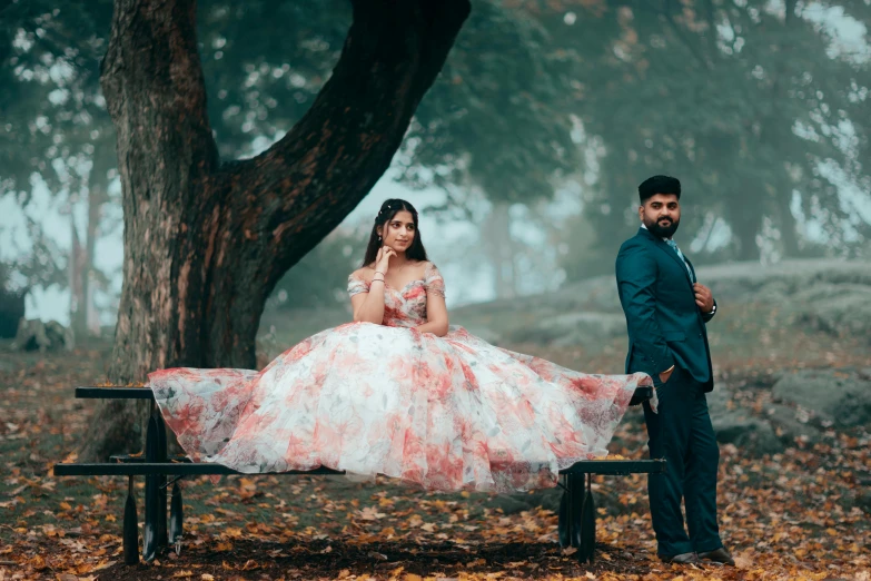 a woman in a dress and man standing beside her