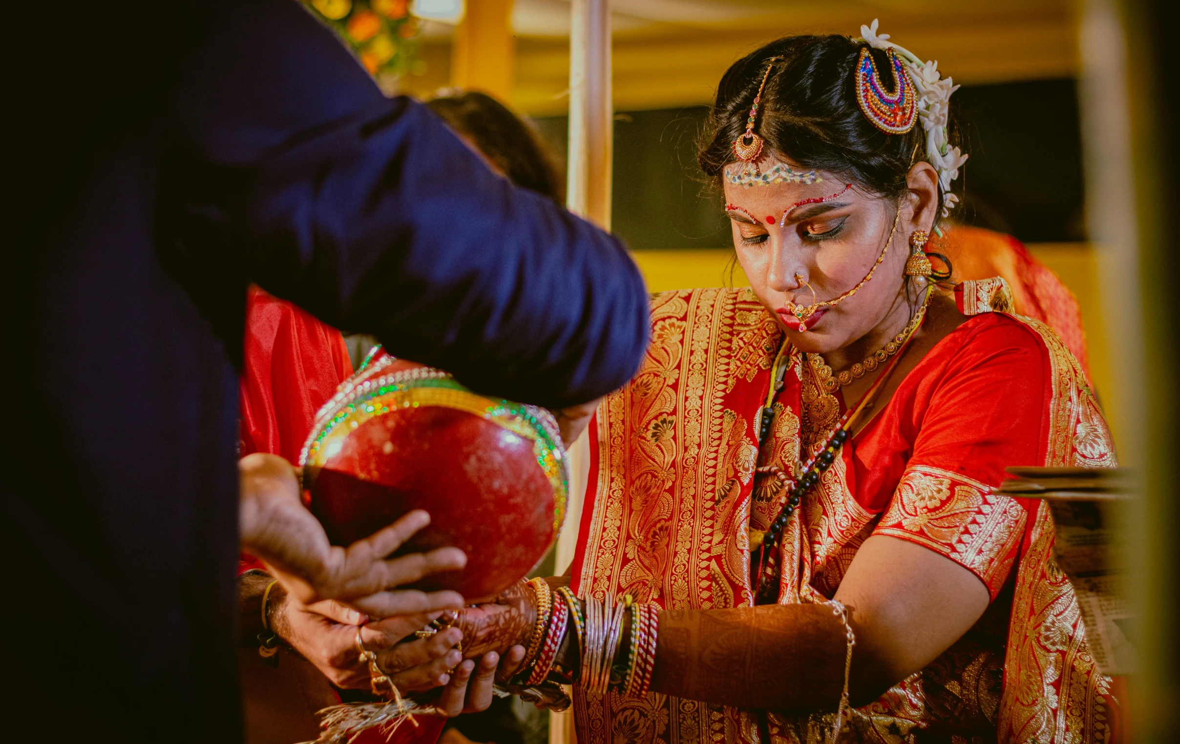 woman getting painted on during wedding ceremony