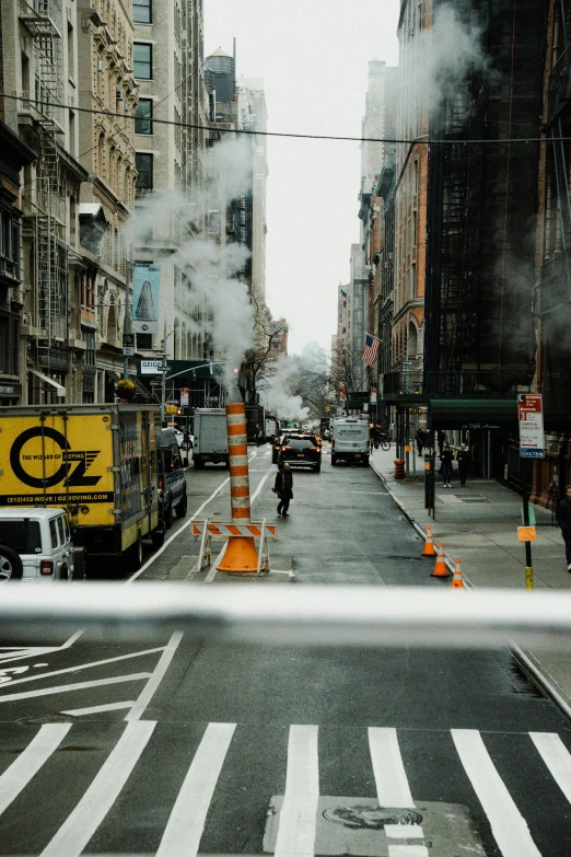 city street scene with smokestacks coming out of the pipes