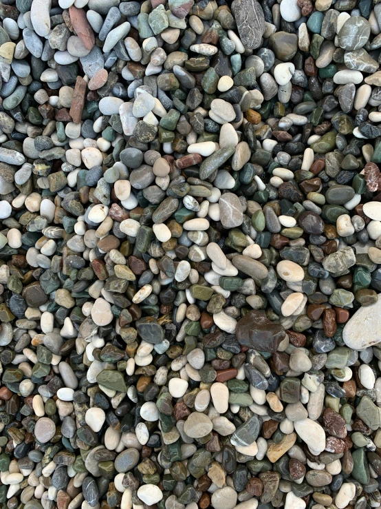 a mixture of rocks and gravel on the ground