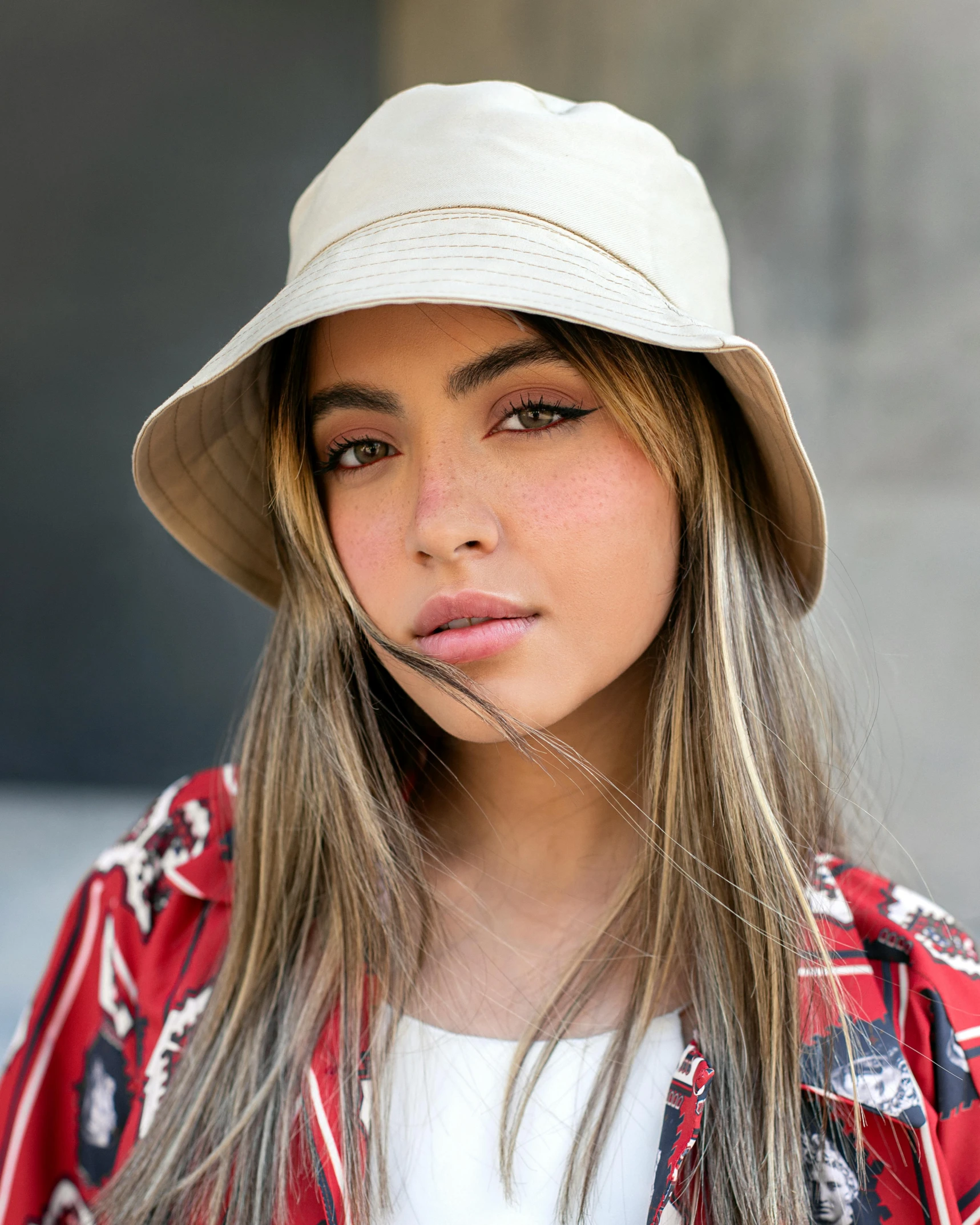 a girl with long hair wearing a hat