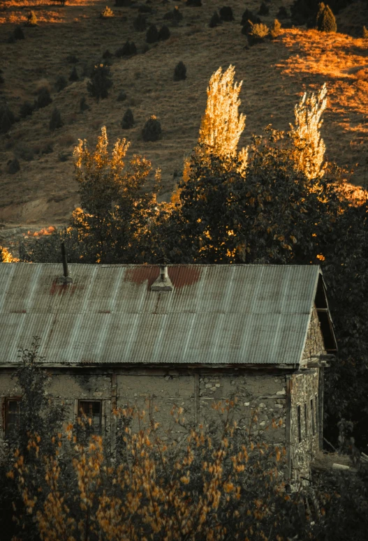 an old brick building sitting in the middle of some trees