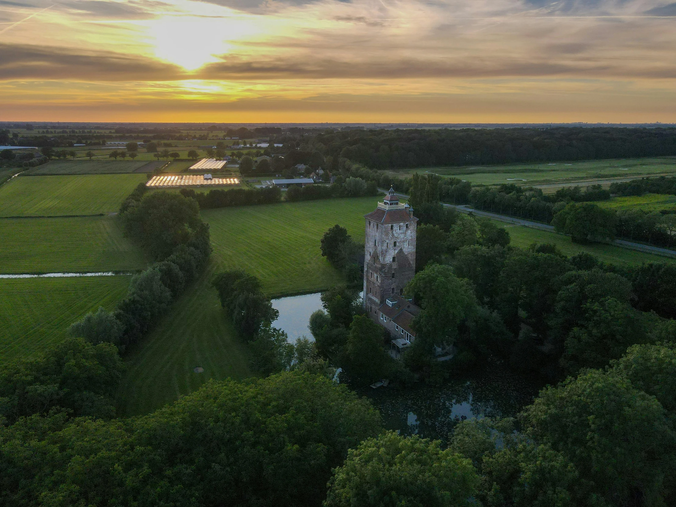 a clock tower is sitting in the middle of trees