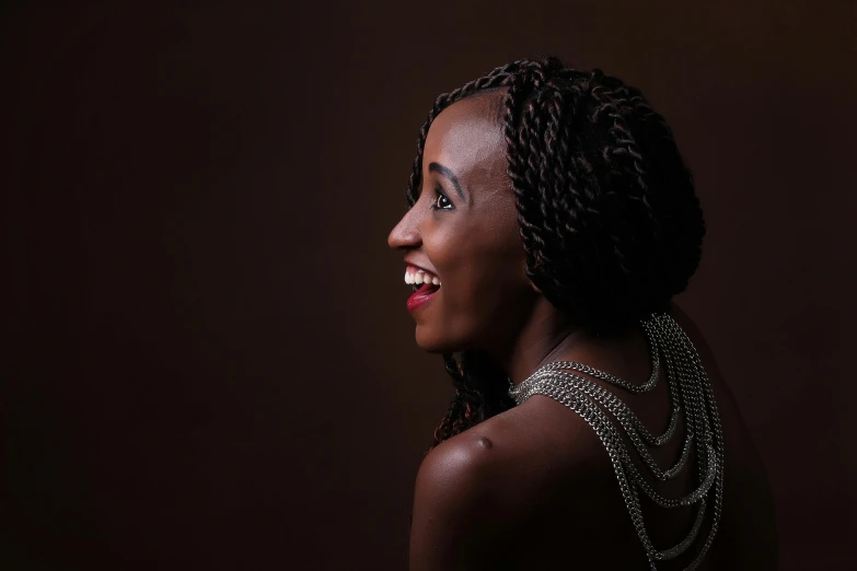 a women looking back in a black background