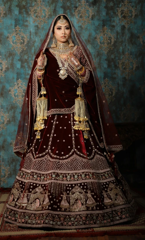 a model wearing an indian bridal in the background