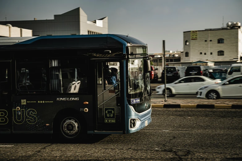 a bus stops at an intersection on a road with traffic