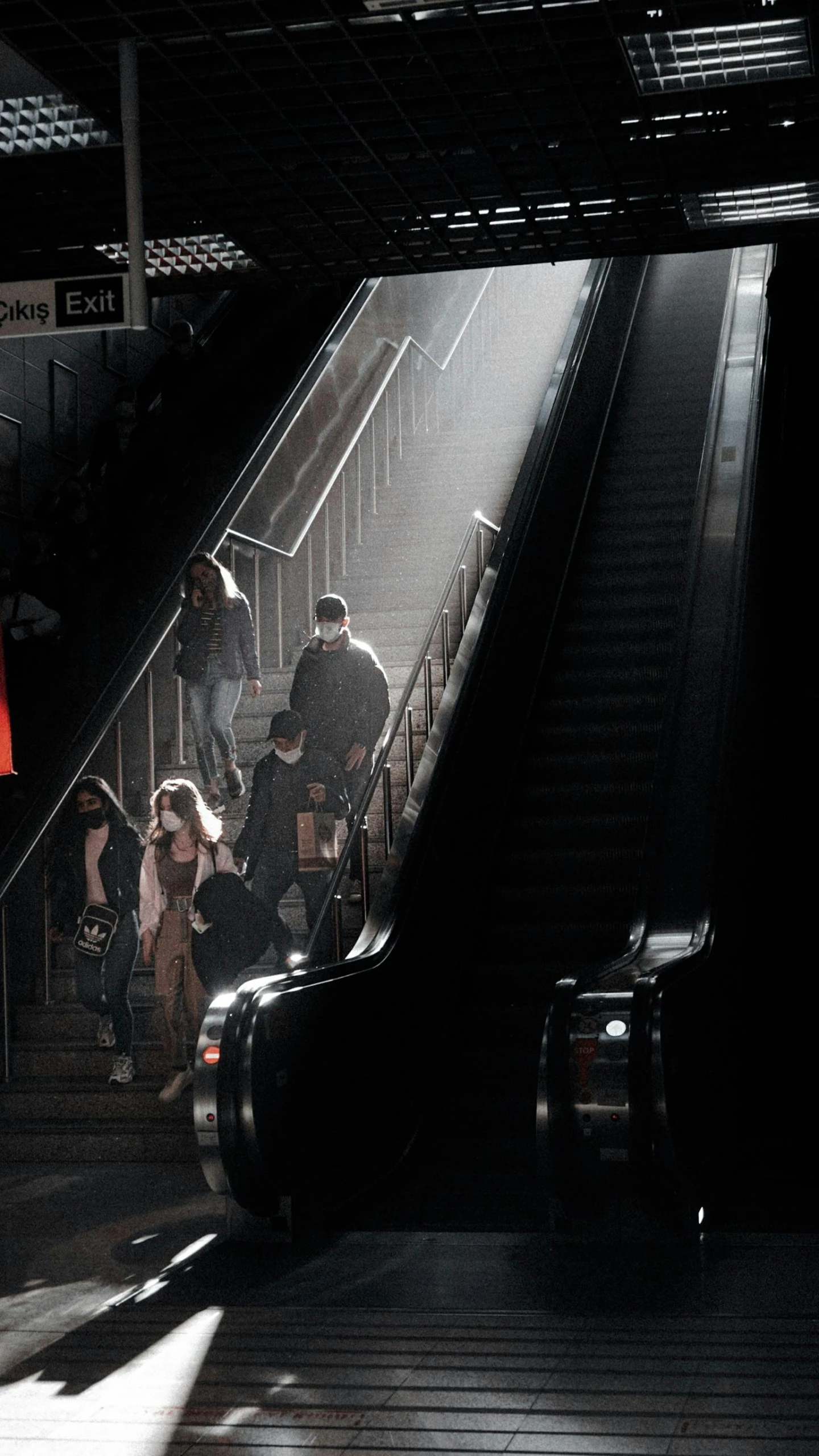 people at an airport escalator moving on a boat