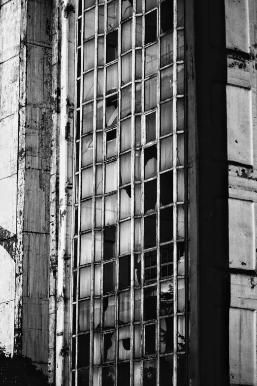 the bottom half of an old building with bars