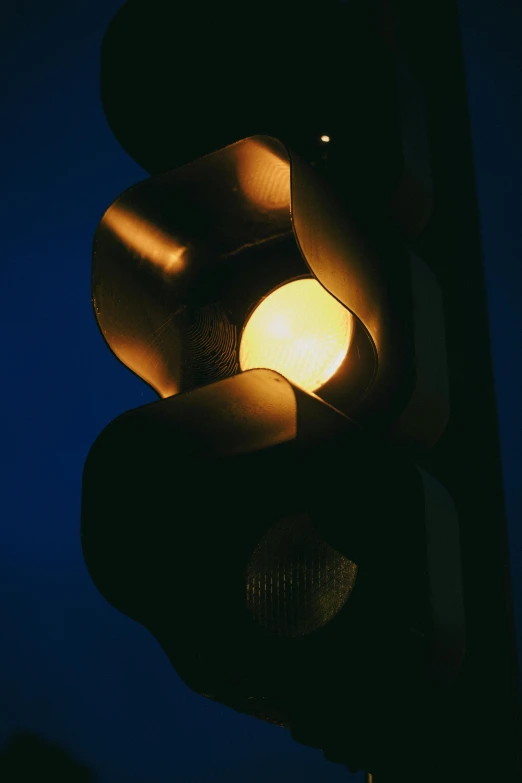 a street light with a traffic signal light hanging from the pole
