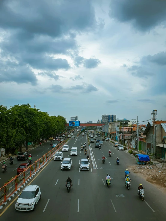 the view down a large street from a bridge