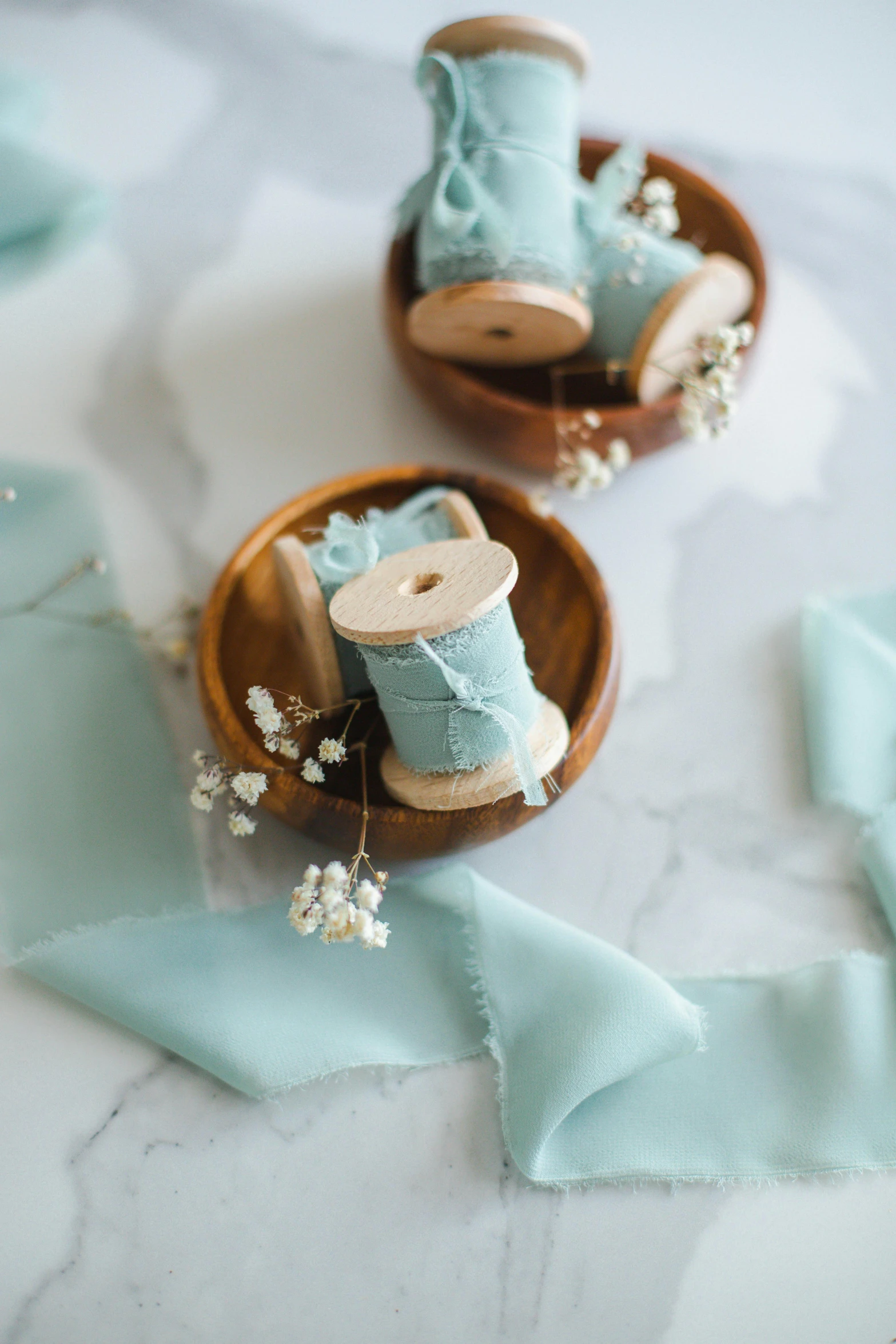 miniature blue shoes on small wooden trays