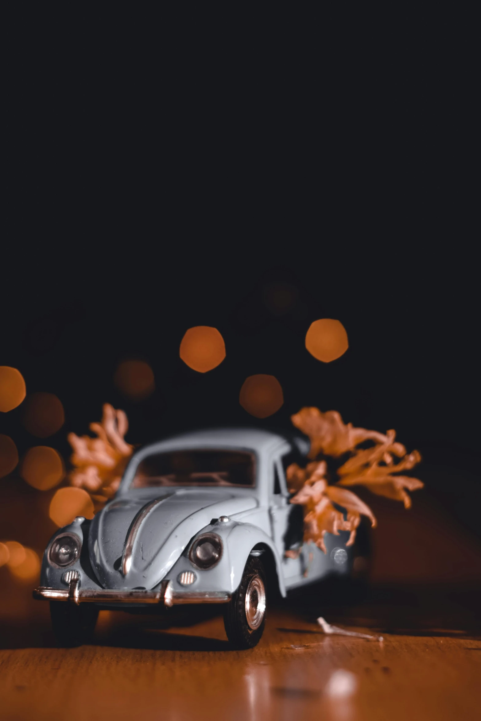 a toy car has been decorated with fake flowers