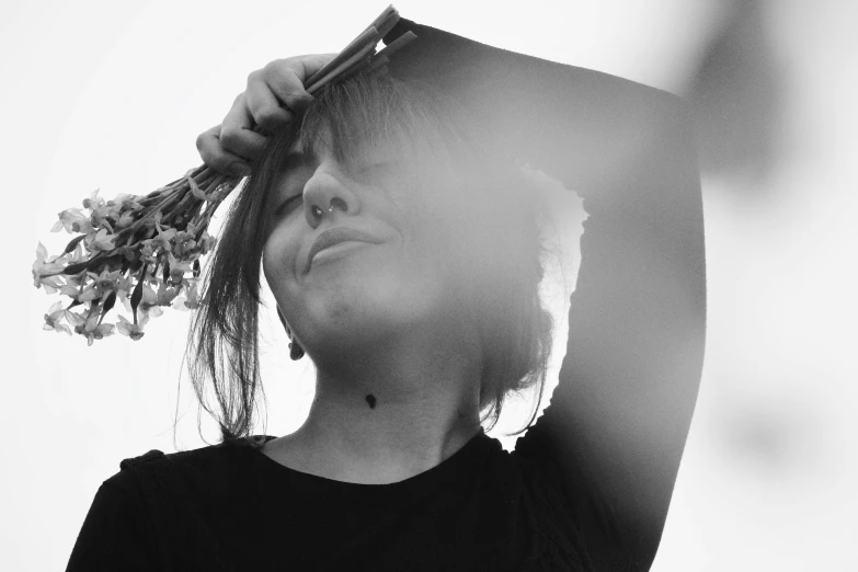 a girl with flowers brushing her hair