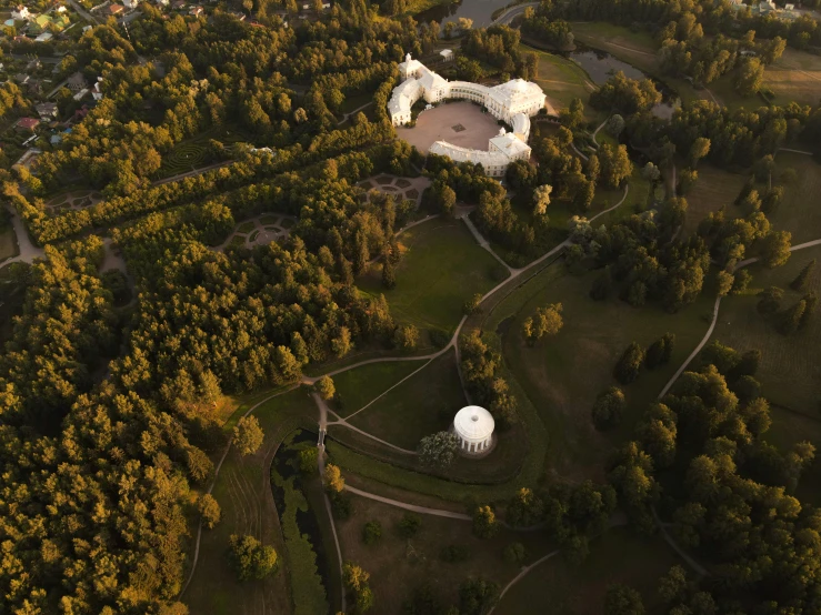 an aerial po of a building in the woods