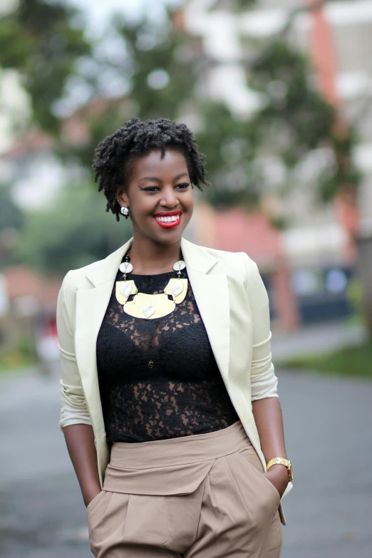 a woman in shorts and a top smiling for the camera