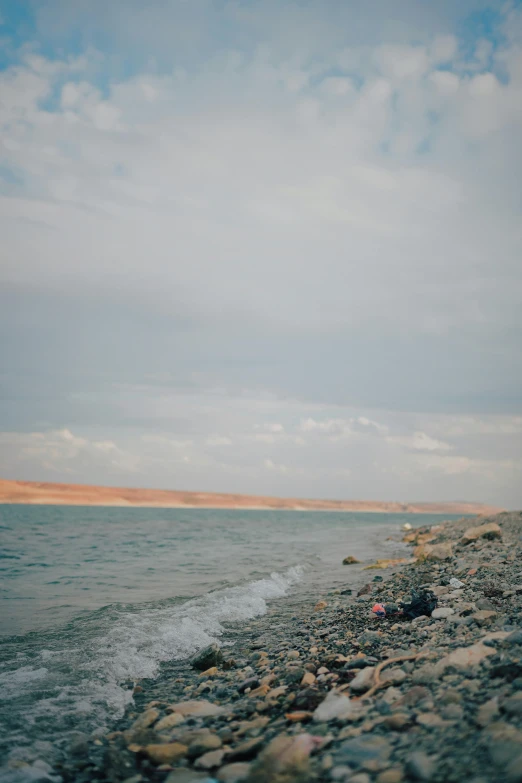 the ocean is calm and empty and full of rocks