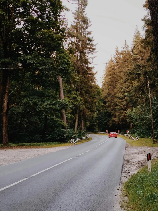 an empty roadway with some bicycles parked on the side