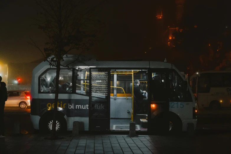 a couple of buses that are sitting in the street