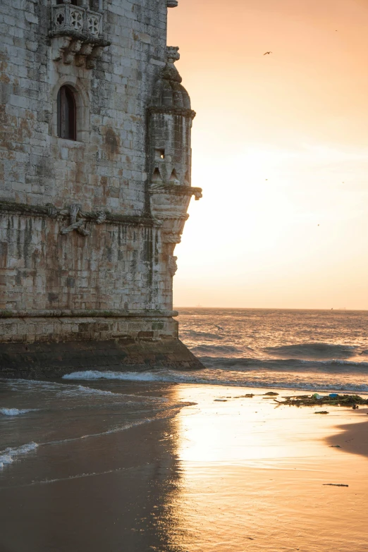 this is a view of an old building from the beach