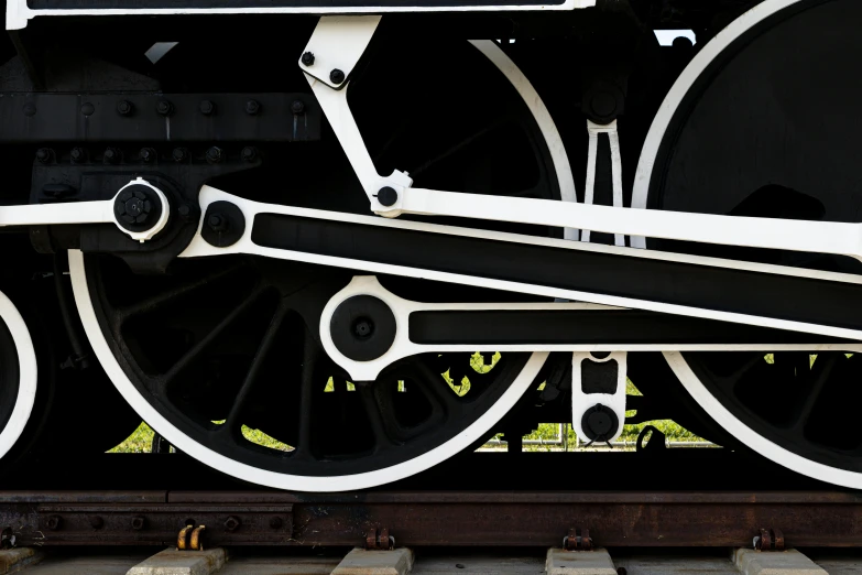 a close up of the wheels on a train car