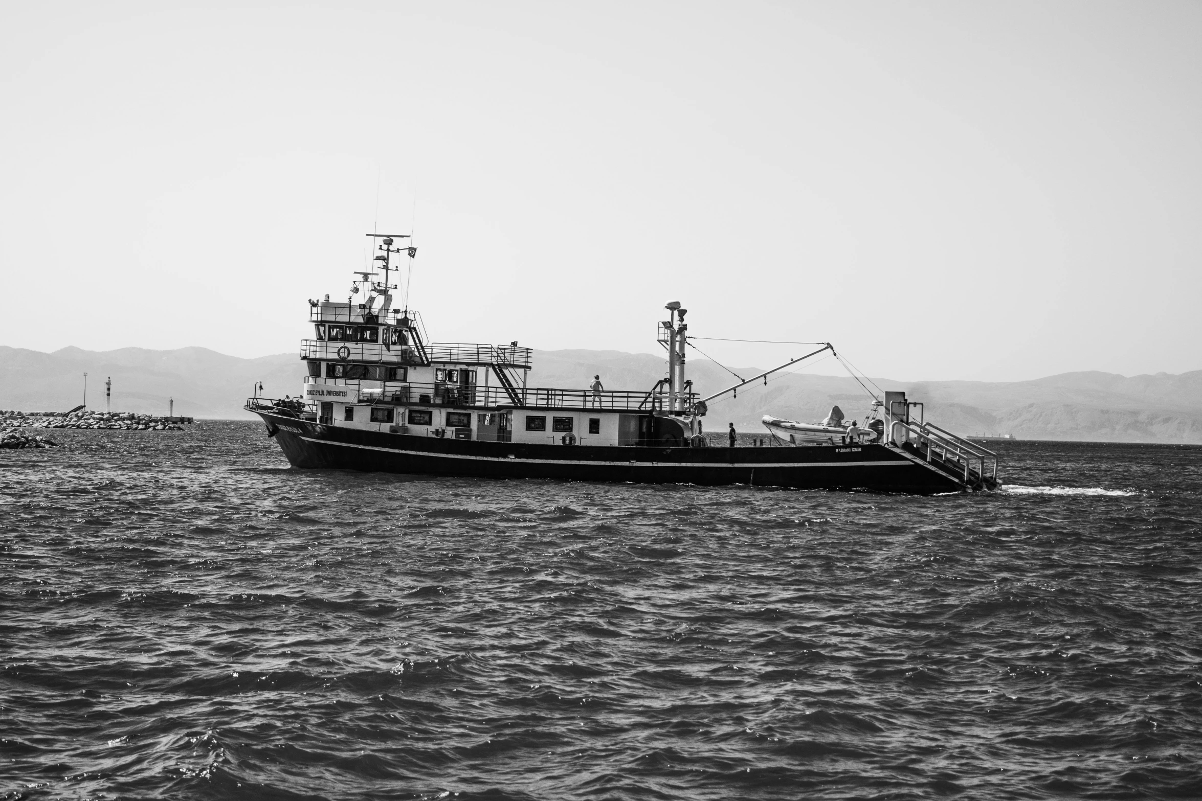 a black and white po of a ship in the water