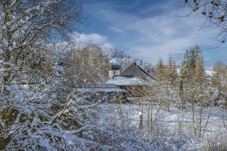 the cabin in the woods is covered with snow