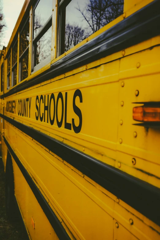 a school bus is parked near the curb