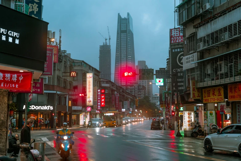 there are many traffic lights and cars on this street