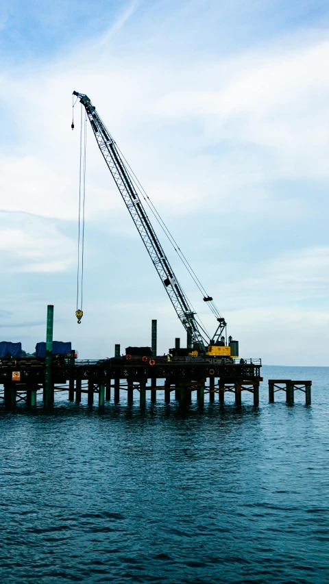 the crane is being constructed on the pier