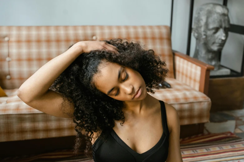 a girl posing with her hand on her head