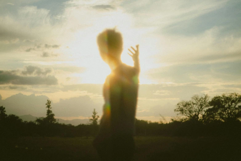 a person with the sun behind them