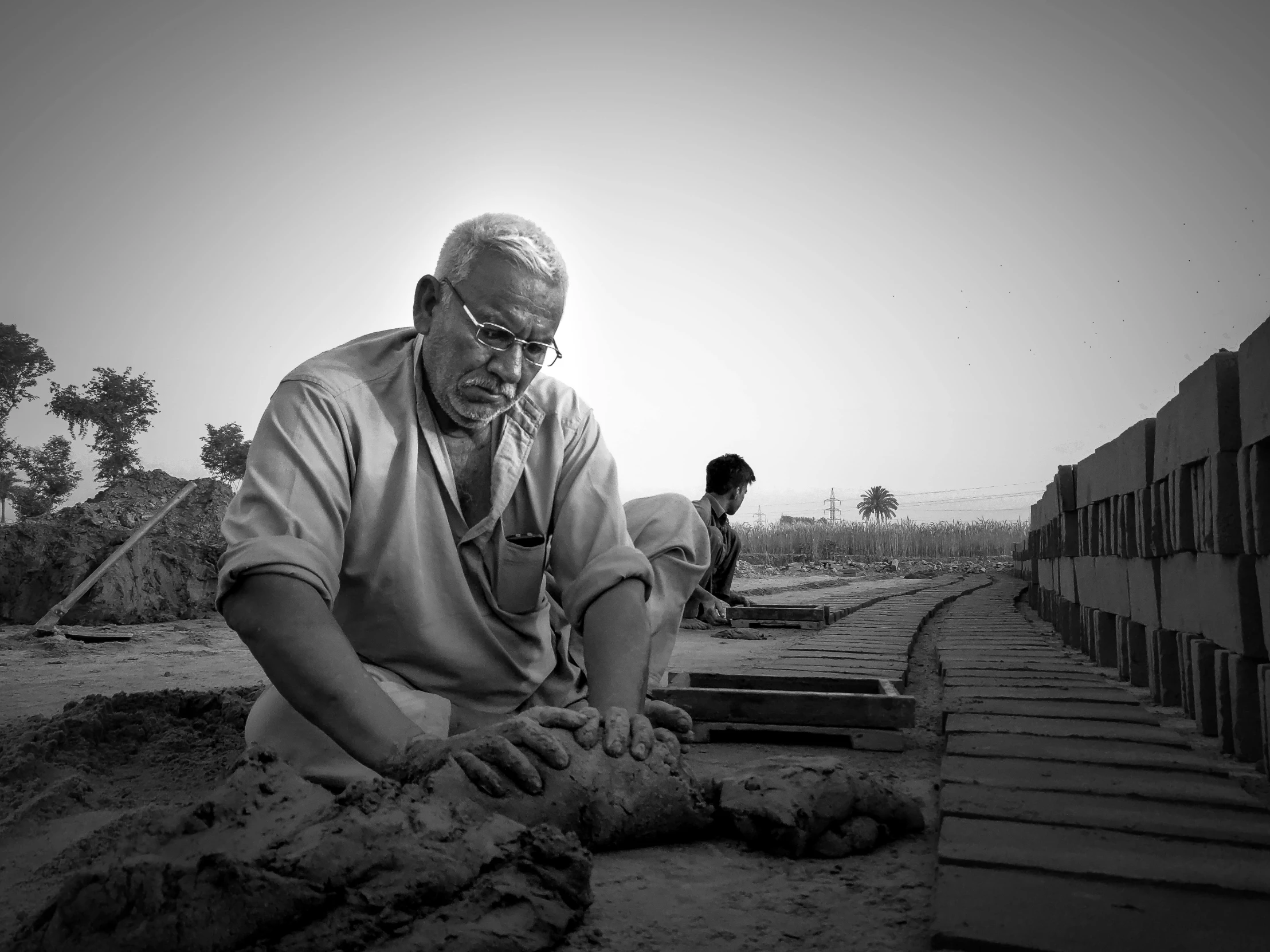 a black and white po of a man working on soing