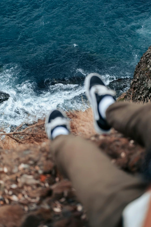 someone lying in their seat watching the ocean