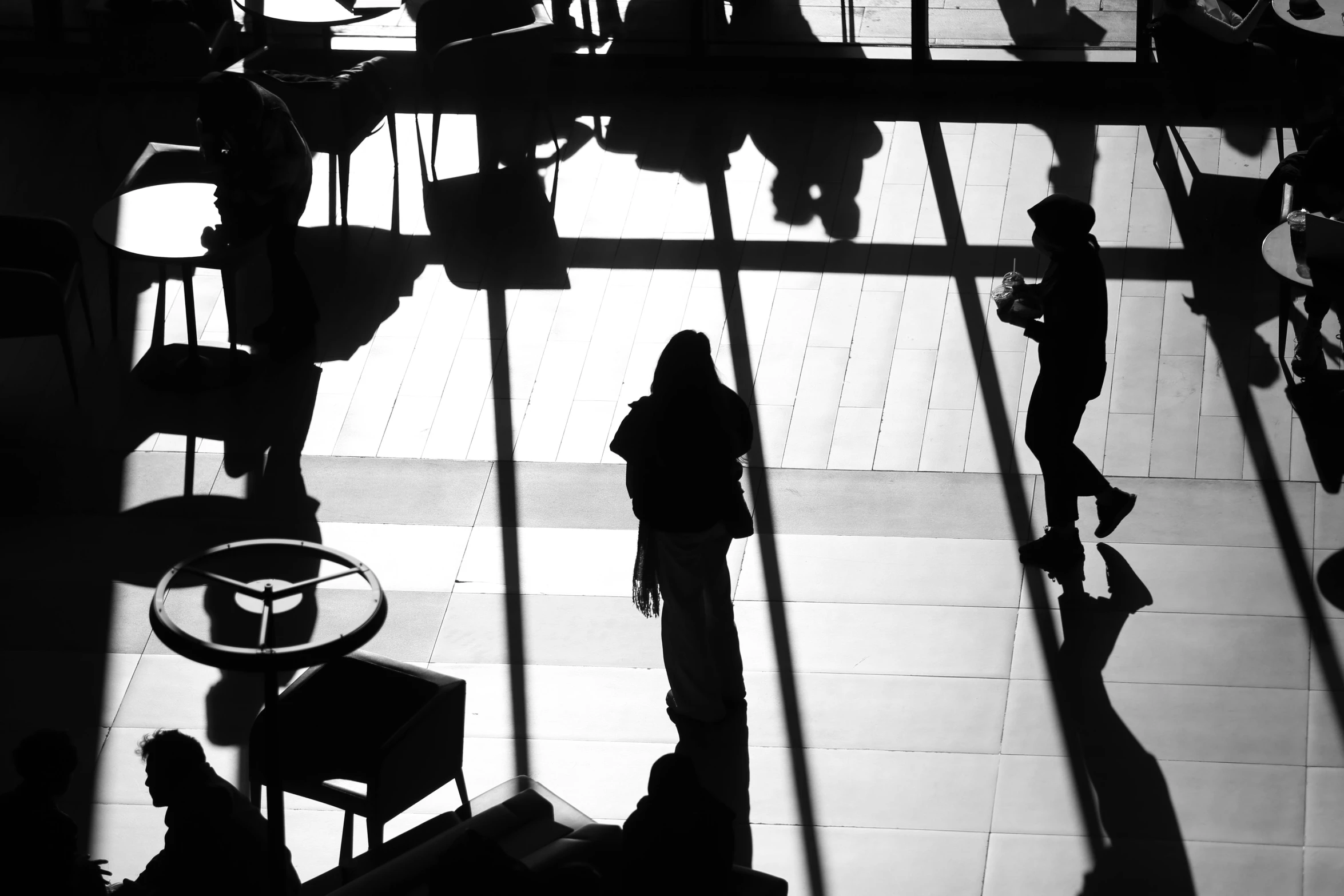 an image of people walking by the wall