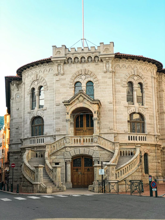 the historic building features a circular staircase leading up to the entrance