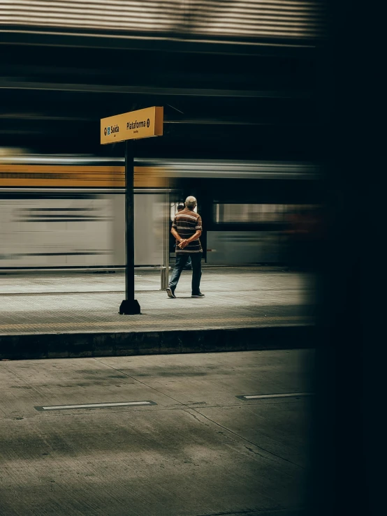 a man that is standing next to a street