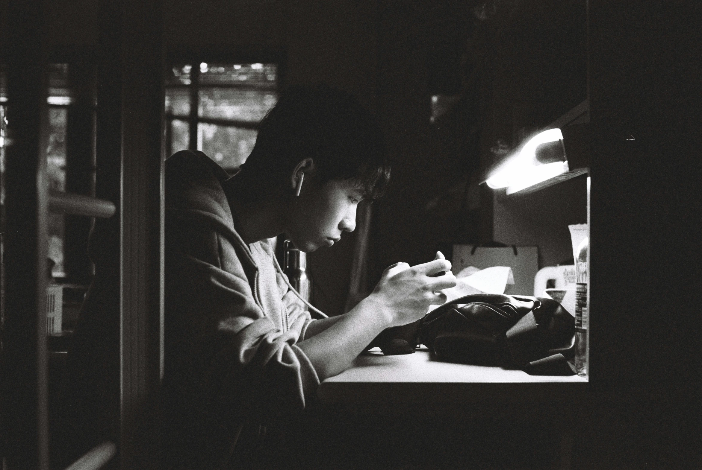 a man sitting at a table in front of a desk