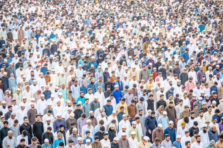 a large group of people are standing together