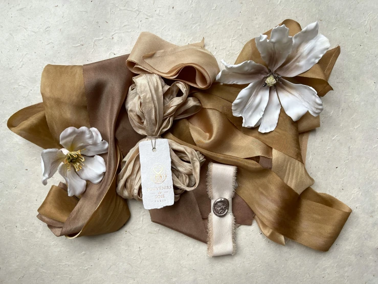 ribbons, flower and gift tags lying on top of each other