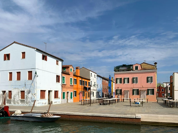 a group of buildings next to a body of water