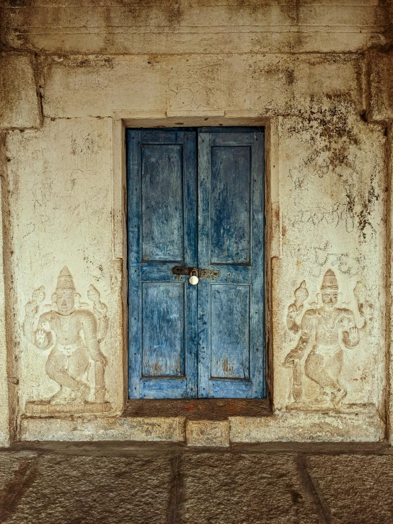 a door and window on a concrete wall